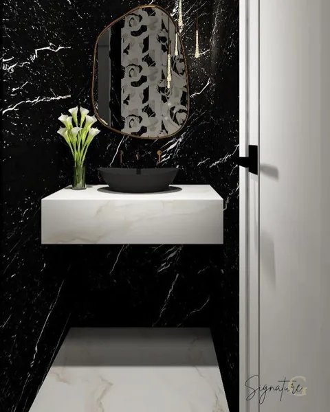 A touch of drama in this mighty powder bathroom 💫✨ Dark walls, floral accent, and a hint of sparkle — Bathrooms